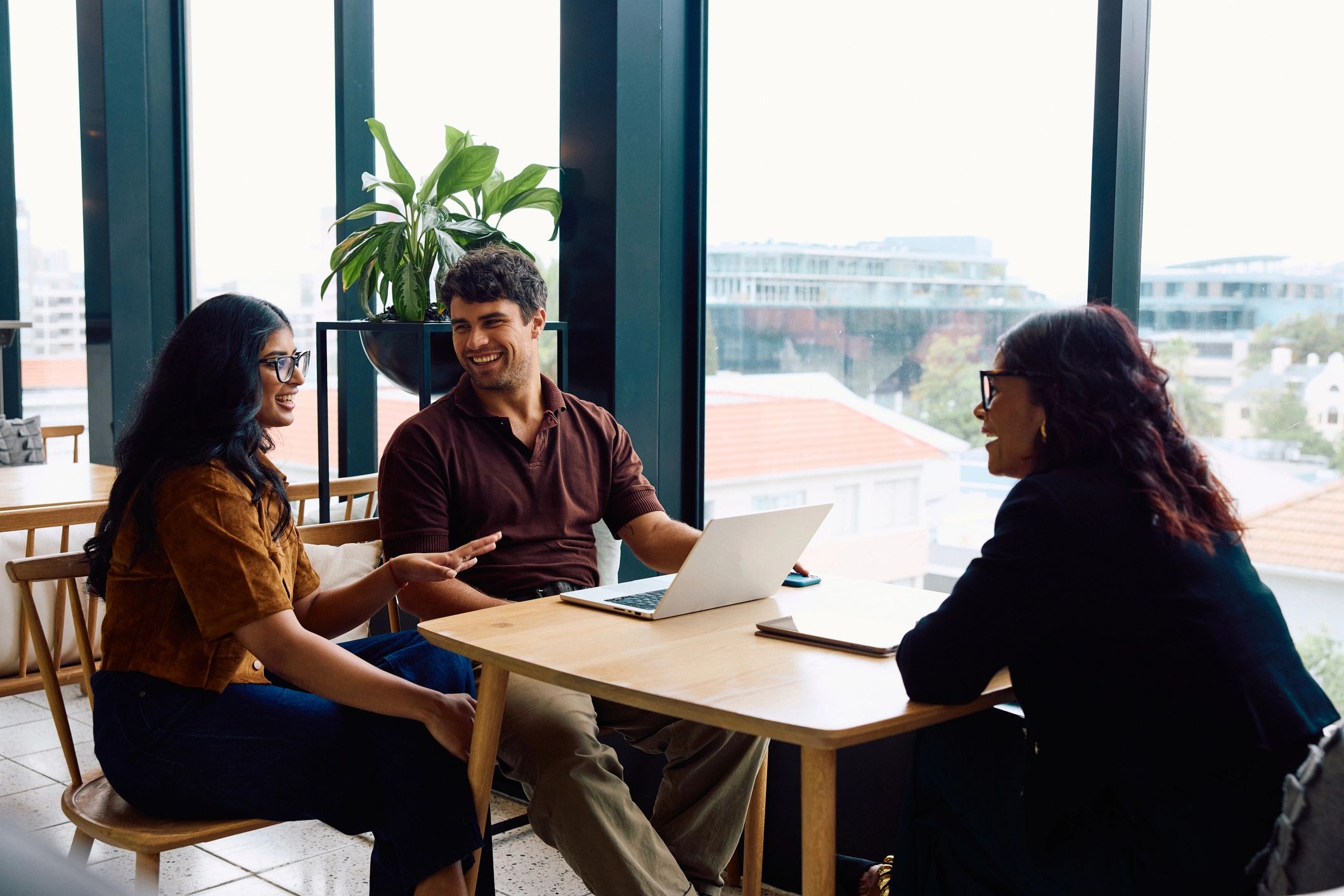 Business advisors meeting with clients in a bright office